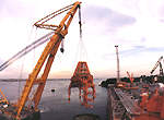 Lifting the turret gantry structure onto the Northern Endeavour at Sembawang.